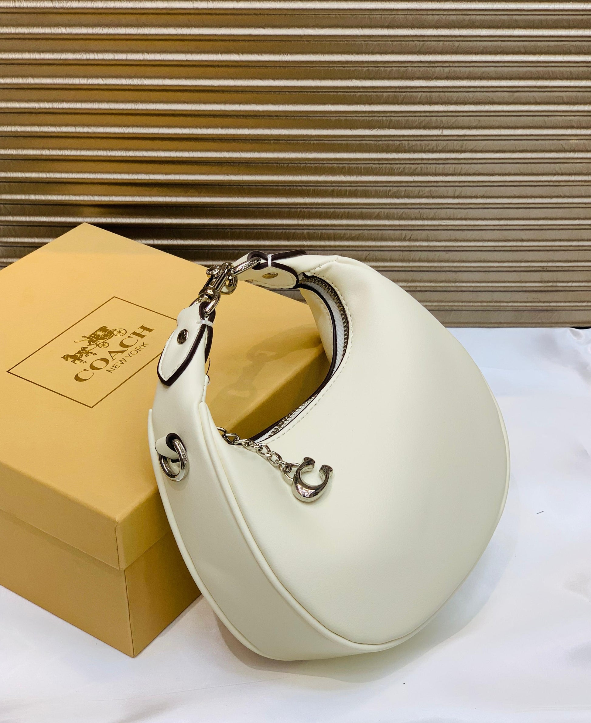 COACH MOON SHAPE CROSSBODY BAG
